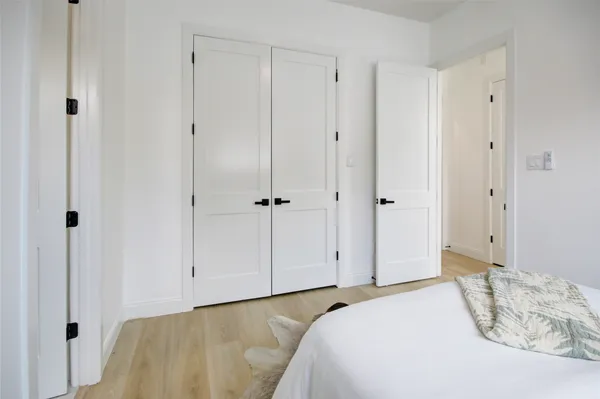 a bedroom with a bed and a bathroom