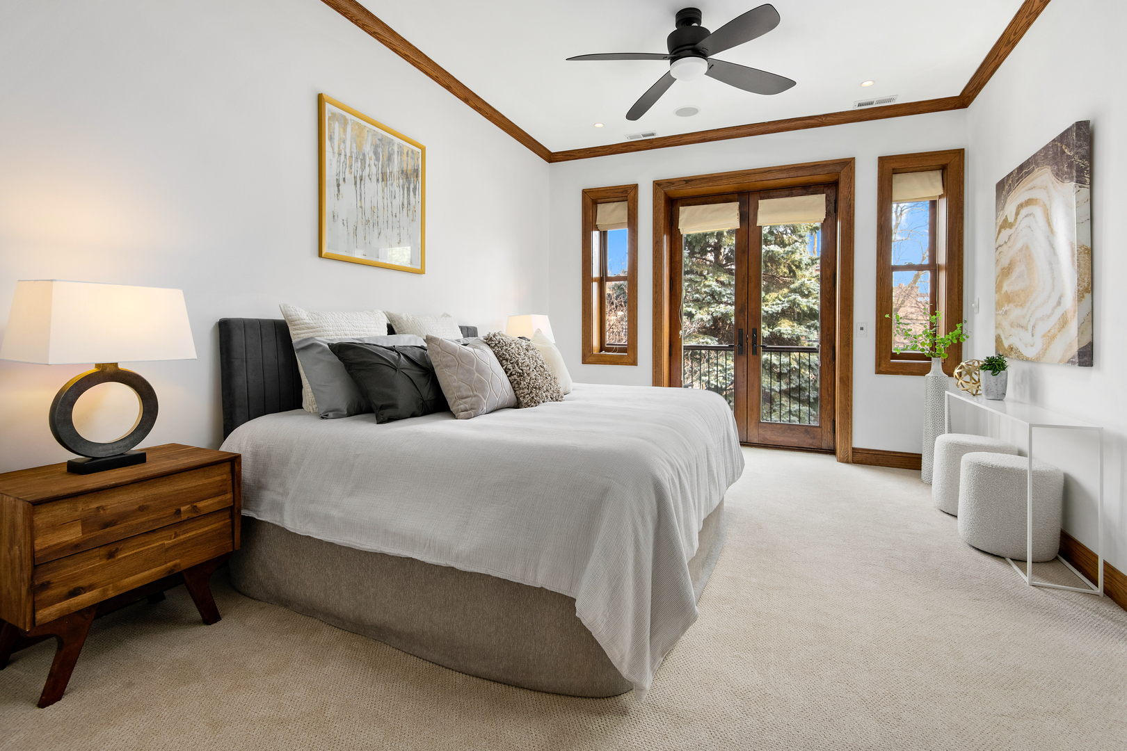 3733 North Wayne Avenue Chicago, IL 60613 - Photo 15 of 40 a bedroom with a bed and a chandelier