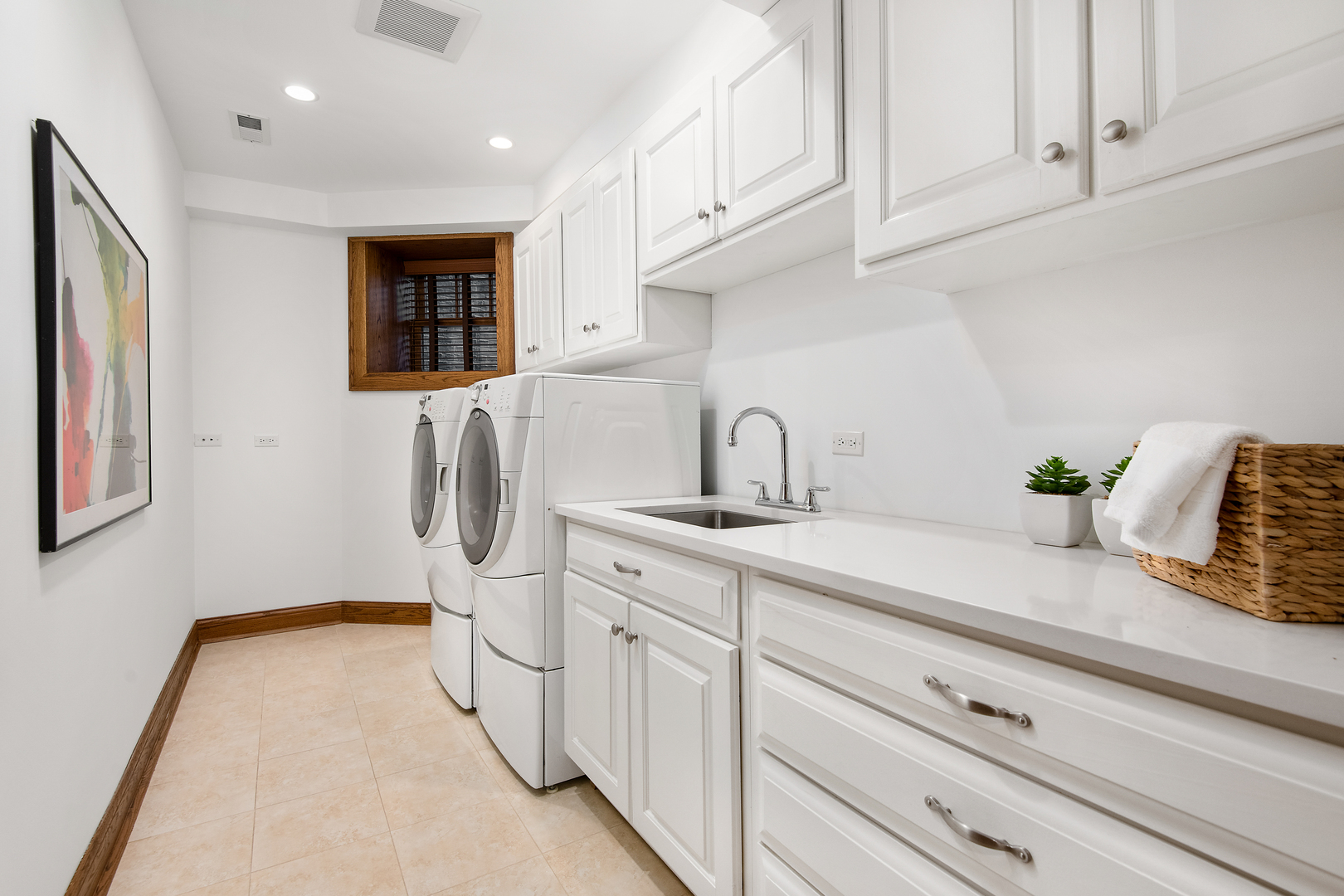 3733 North Wayne Avenue Chicago, IL 60613 - Photo 28 of 40 a kitchen with stainless steel appliances a sink and cabinets