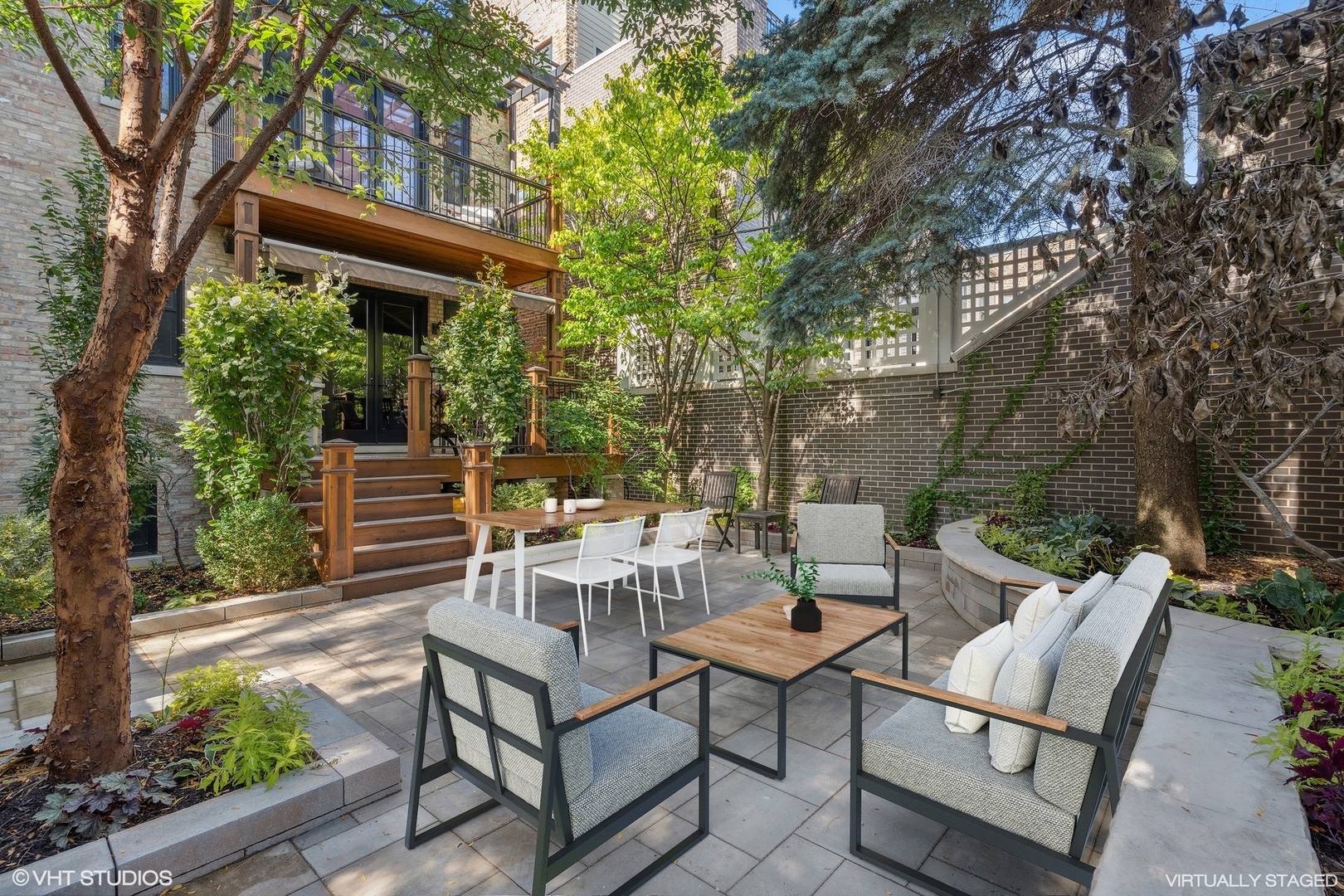 3733 North Wayne Avenue Chicago, IL 60613 - Photo 34 of 40 a view of backyard with a table and chairs and potted plants