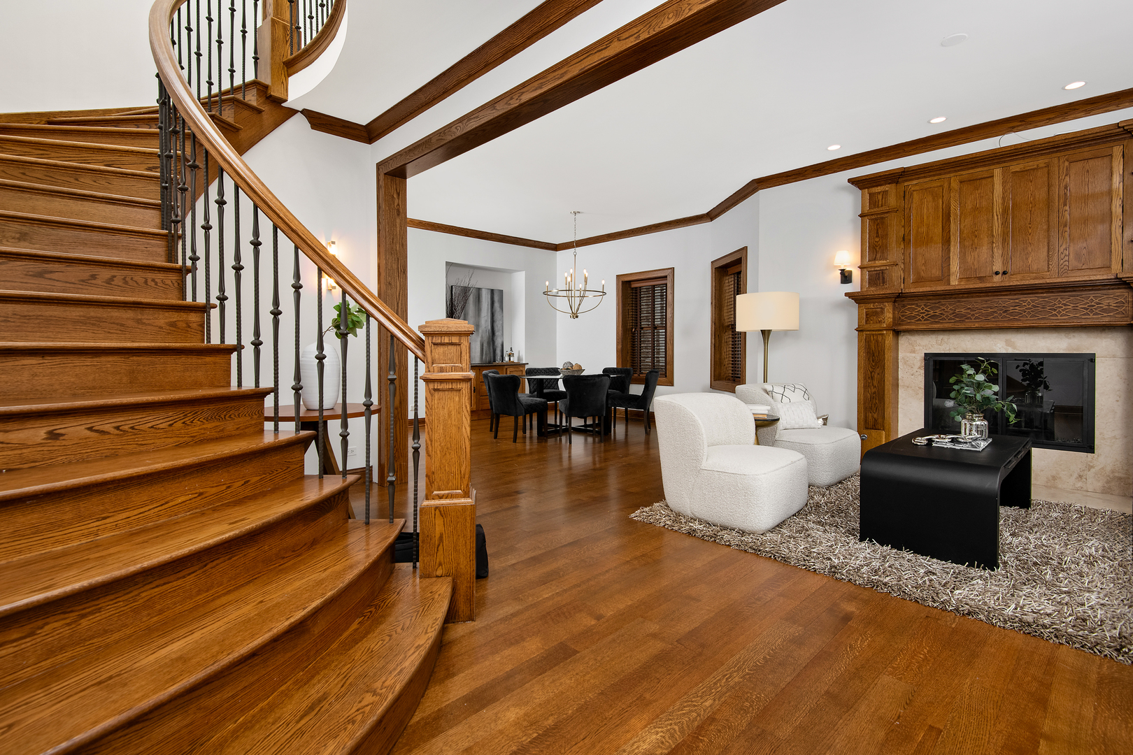 3733 North Wayne Avenue Chicago, IL 60613 - Photo 4 of 40 a living room with wooden floor and a fireplace