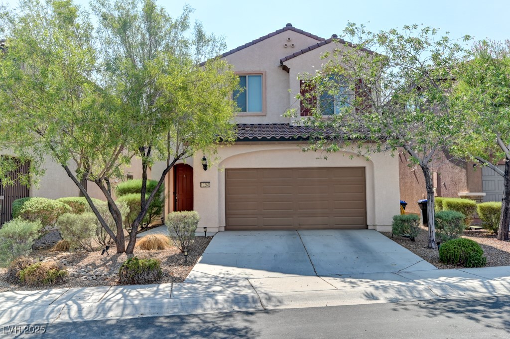 10281 Numaga Road Las Vegas, NV 89178 - Photo 1 of 41 Mediterranean / spanish home featuring driveway, a garage, stucco siding, and a tiled roof