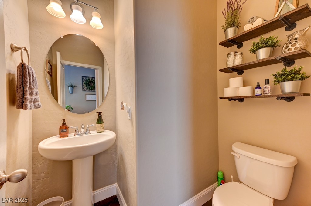 10281 Numaga Road Las Vegas, NV 89178 - Photo 14 of 41 Half bath with toilet and a textured wall