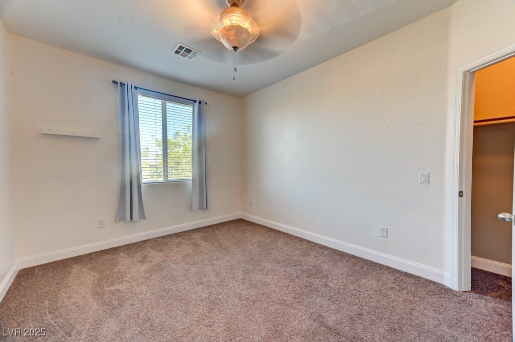 10281 Numaga Road Las Vegas, NV 89178 - Photo 16 of 41 Unfurnished bedroom with carpet floors and ceiling fan