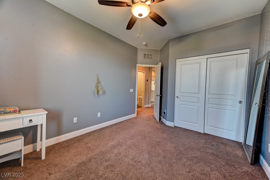 10281 Numaga Road Las Vegas, NV 89178 - Photo 23 of 41 Unfurnished bedroom featuring carpet floors, a closet, and ceiling fan