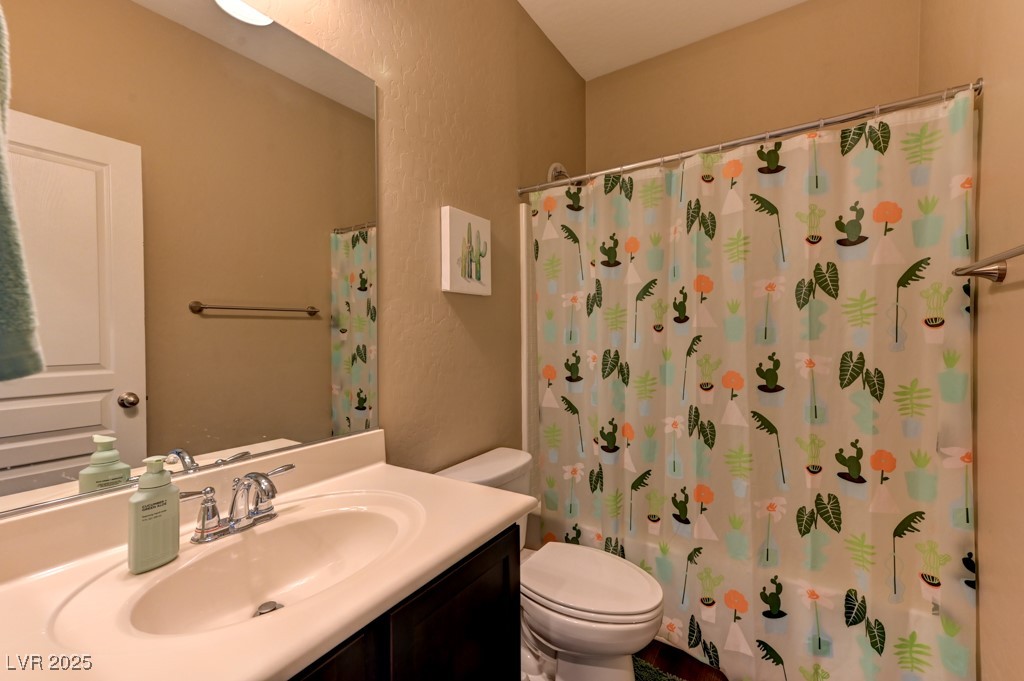 10281 Numaga Road Las Vegas, NV 89178 - Photo 24 of 41 Bathroom with vanity and shower / bathtub combination with curtain