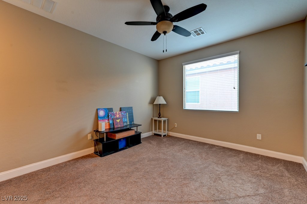 10281 Numaga Road Las Vegas, NV 89178 - Photo 25 of 41 Spare room with light colored carpet and a ceiling fan