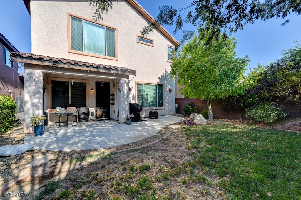 10281 Numaga Road Las Vegas, NV 89178 - Photo 35 of 41 Rear view of house featuring a patio area, stucco siding, and a tiled roof