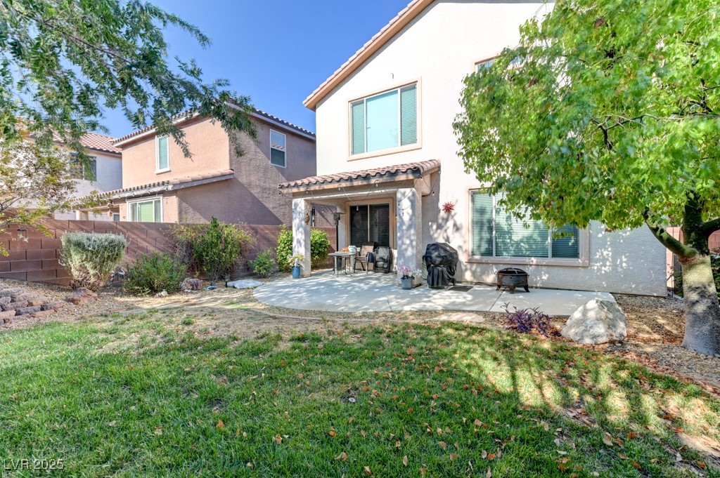 10281 Numaga Road Las Vegas, NV 89178 - Photo 36 of 41 Back of house with a patio area, stucco siding, and a tile roof