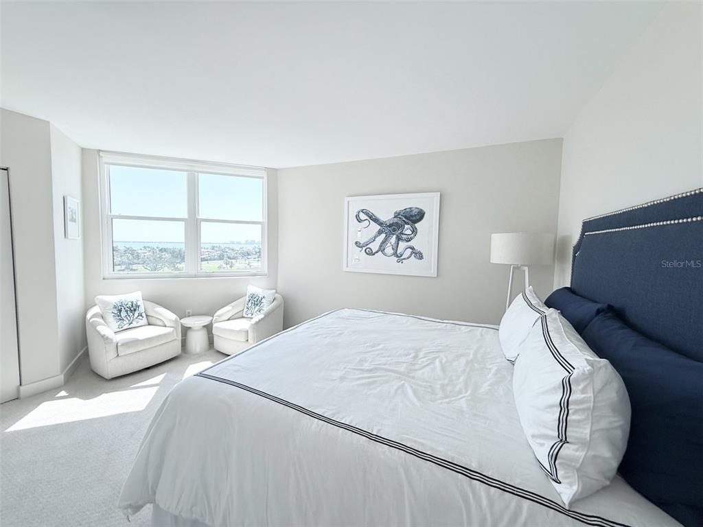 1050 Longboat Club Road, Unit 803 Longboat Key, FL 34228 - Photo 26 of 39 a bedroom with a bed and wooden floor
