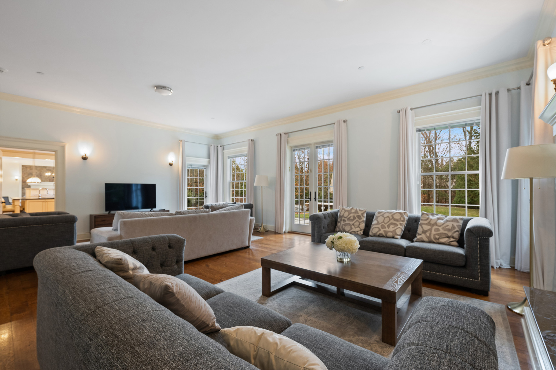 5020 Grosvenor Avenue, Unit 1 Bronx, NY 10471 - Photo 17 of 32 a living room with furniture a flat screen tv and a large window