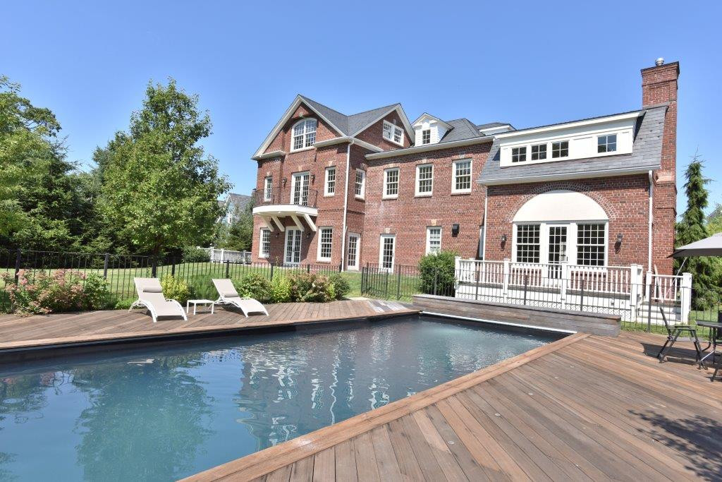 5020 Grosvenor Avenue, Unit 1 Bronx, NY 10471 - Photo 2 of 32 a front view of a house with lots of trees
