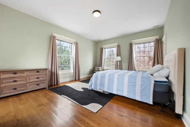 a bedroom with a bed and window