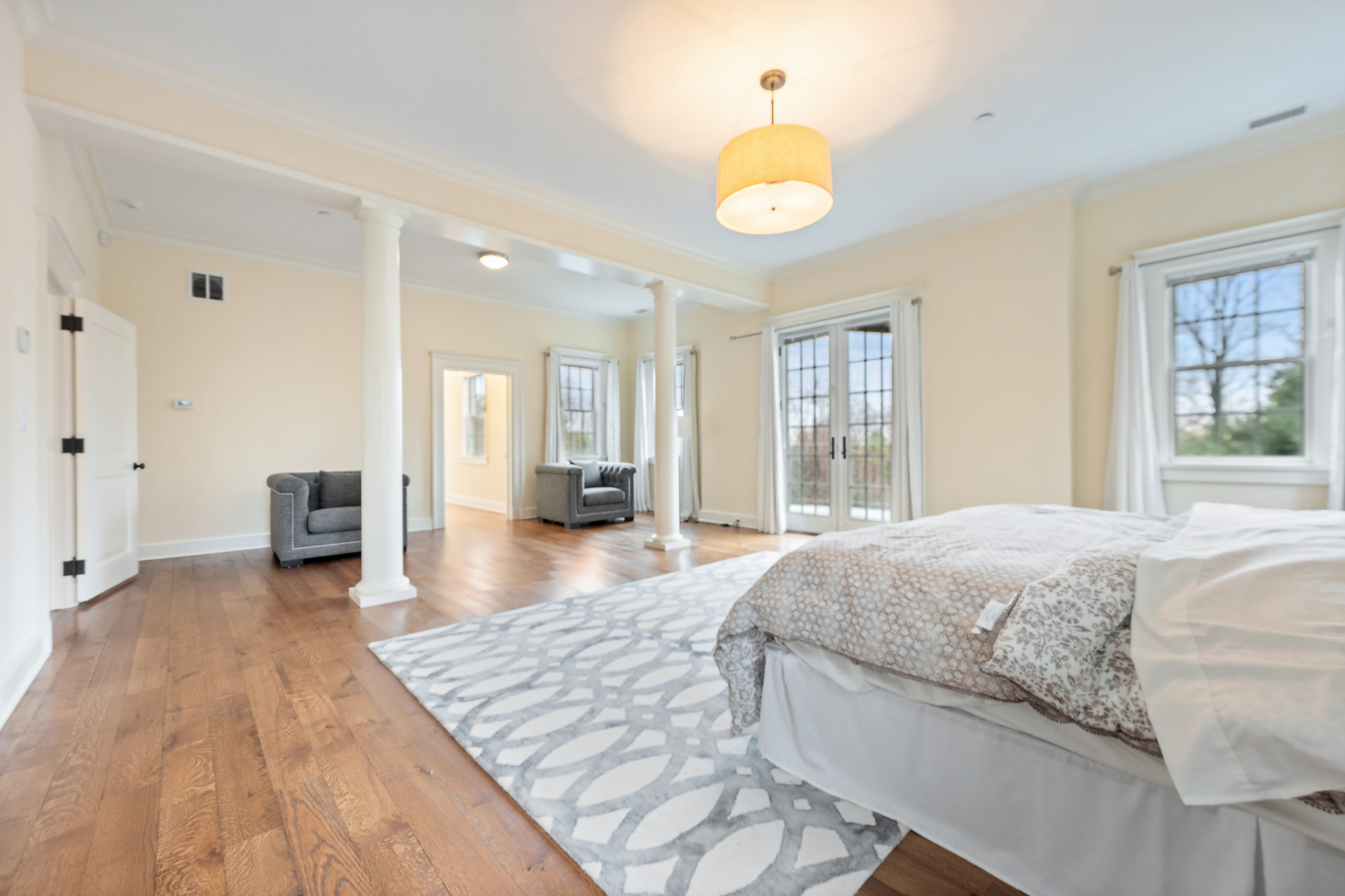 5020 Grosvenor Avenue, Unit 1 Bronx, NY 10471 - Photo 26 of 32 a spacious bedroom with a bed and wooden floor