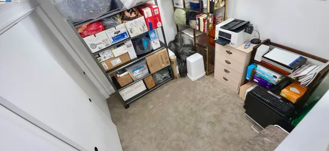 a front view of a house with a yard and potted plants