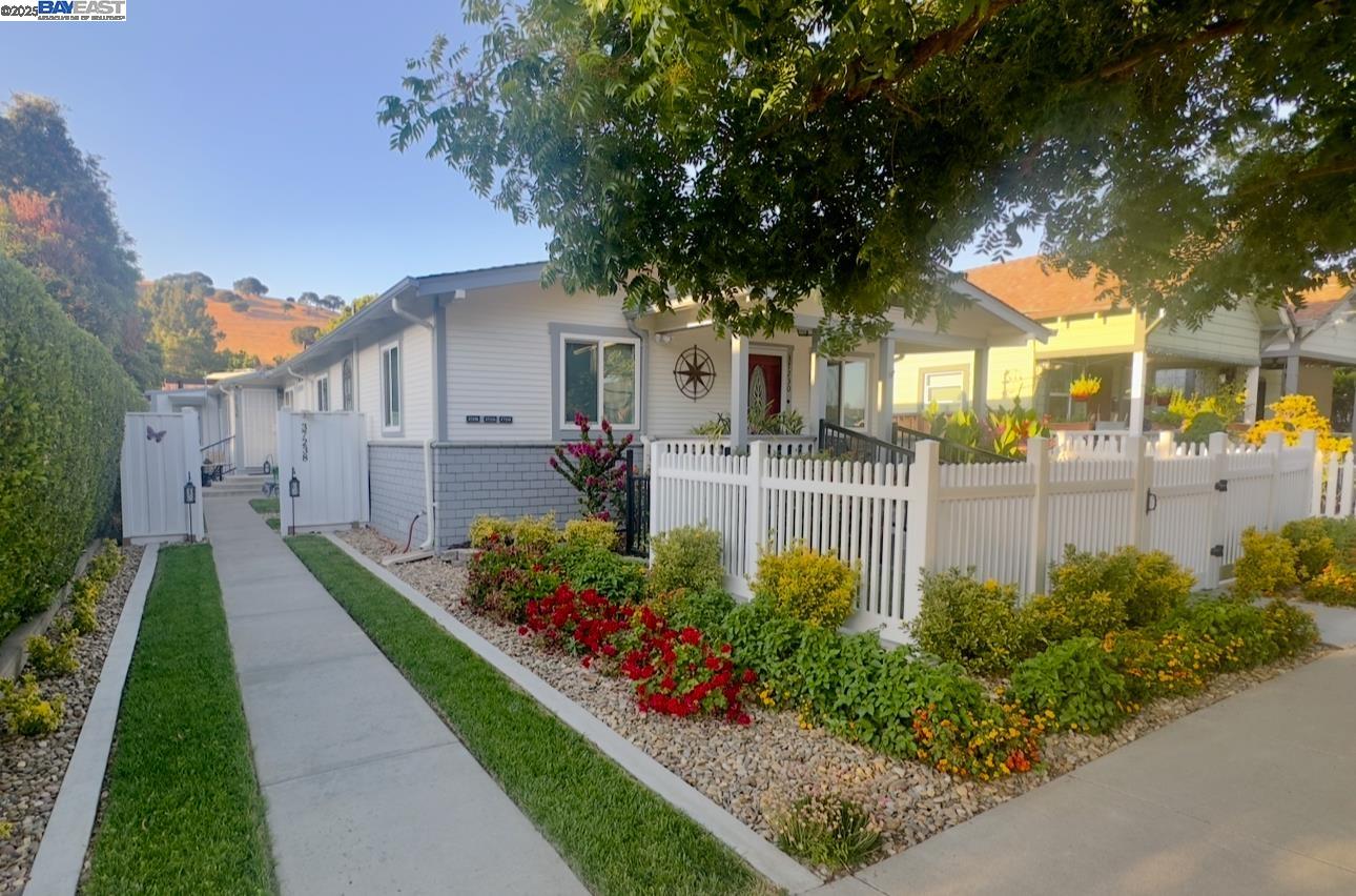 37230 2nd Street Fremont, CA 94536 - Photo 16 of 49 a front view of a house with a yard and potted plants