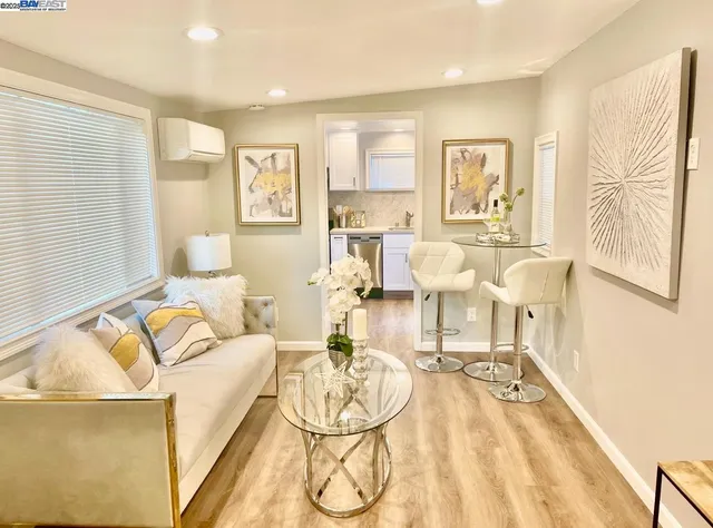 a kitchen with stainless steel appliances granite countertop white cabinets sink and dishwasher