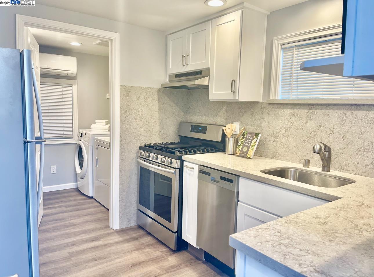 37230 2nd Street Fremont, CA 94536 - Photo 20 of 49 a kitchen with stainless steel appliances granite countertop a sink stove and refrigerator