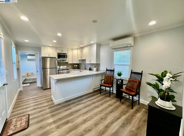 a bedroom with a bed and a potted plant