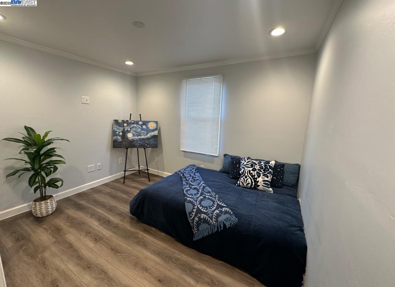 37230 2nd Street Fremont, CA 94536 - Photo 30 of 49 a bedroom with a bed and a potted plant