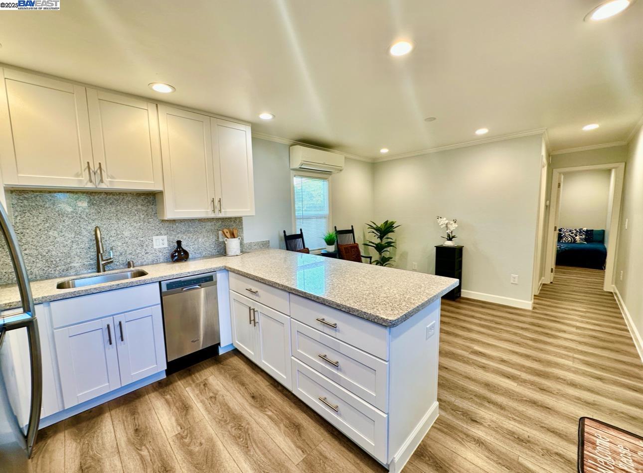 37230 2nd Street Fremont, CA 94536 - Photo 33 of 49 a large kitchen with kitchen island a sink stainless steel appliances and cabinets