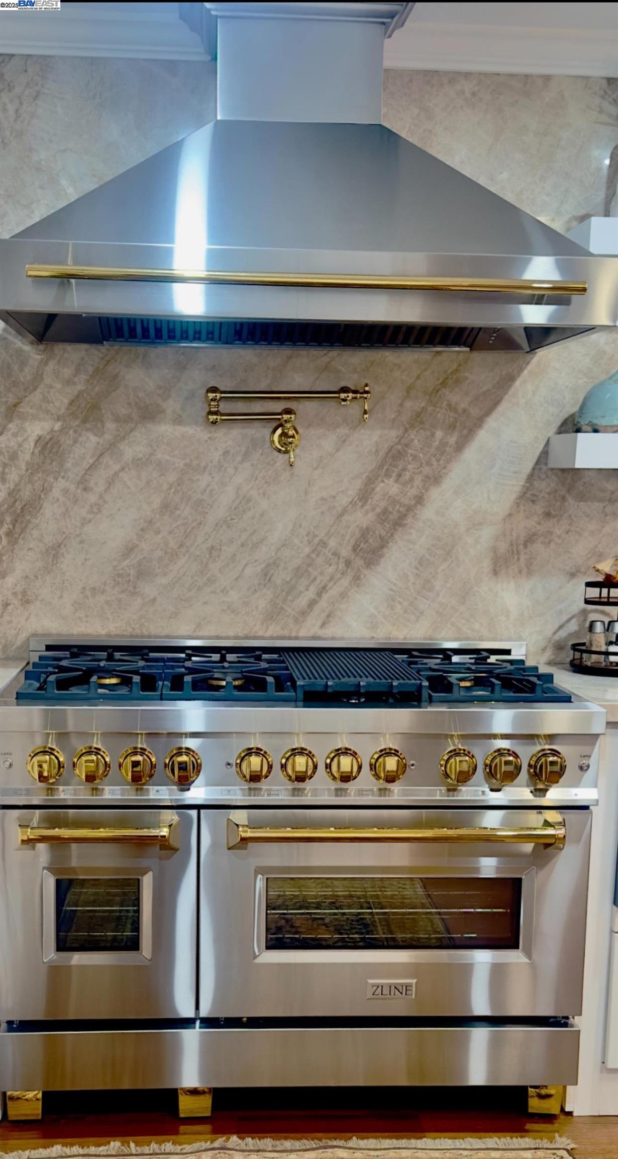 37230 2nd Street Fremont, CA 94536 - Photo 6 of 49 a stove top oven sitting inside of a kitchen