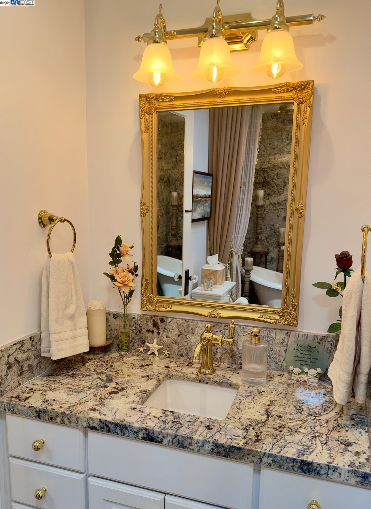 37230 2nd Street Fremont, CA 94536 - Photo 9 of 49 a bathroom with a granite countertop sink and a mirror