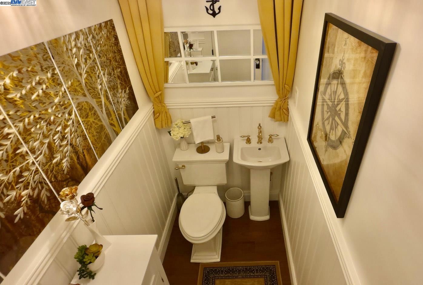 37230 2nd Street Fremont, CA 94536 - Photo 10 of 49 a bathroom with a toilet a sink and a mirror