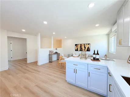 a view of kitchen with a sink dishwasher stove and cabinets