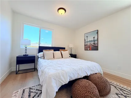 a bedroom with a bed and a lamp