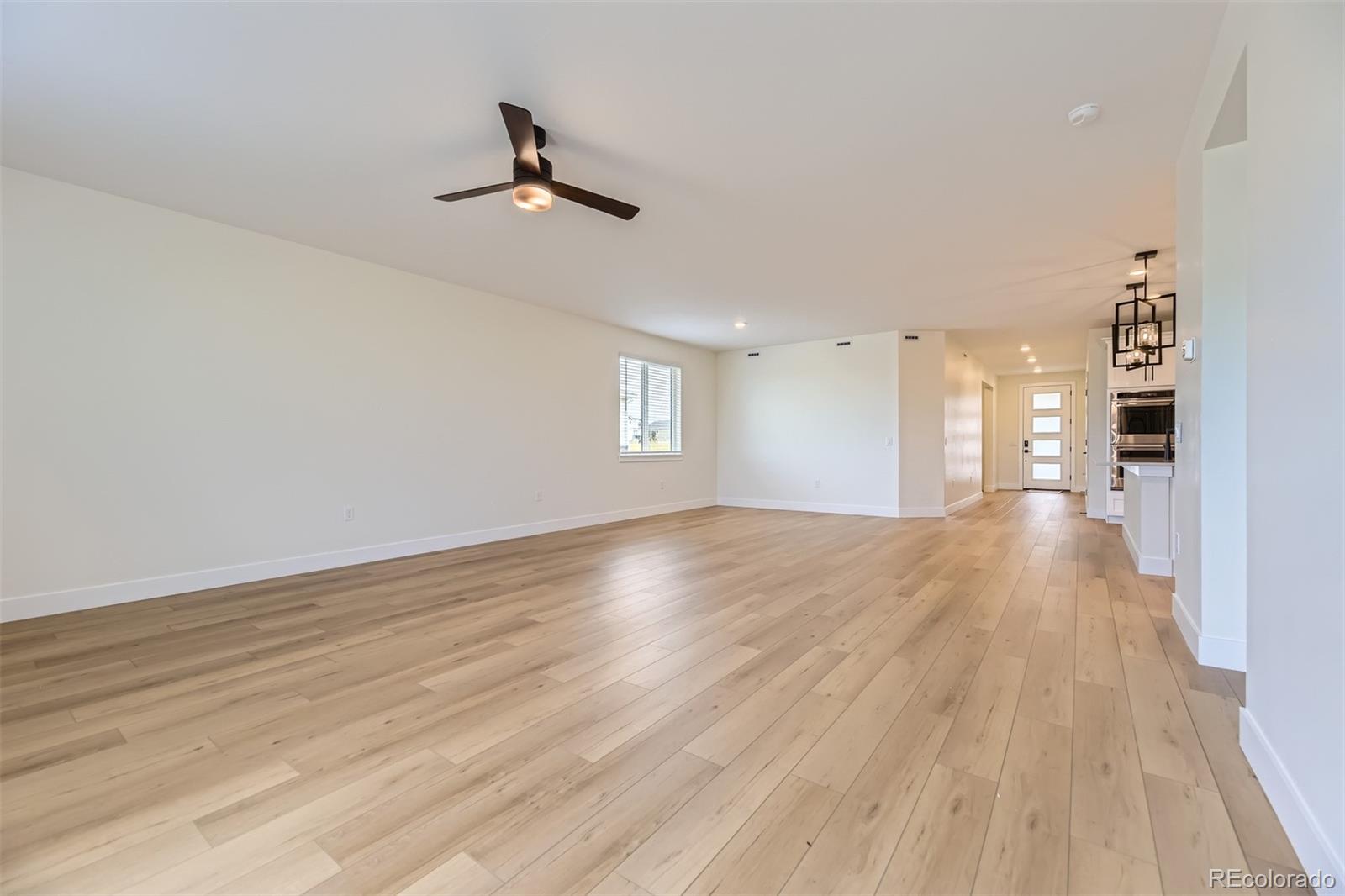 42998 Colonial Trail Elizabeth, CO 80107 - Photo 11 of 27 a view of empty room with wooden floor