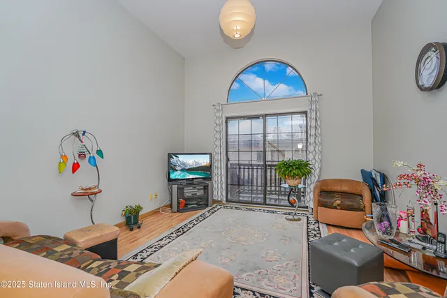 a room with furniture and a flat screen tv