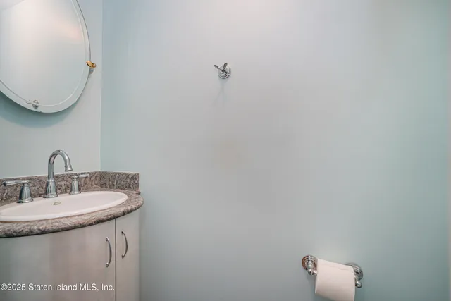 a bathroom with a sink and mirror
