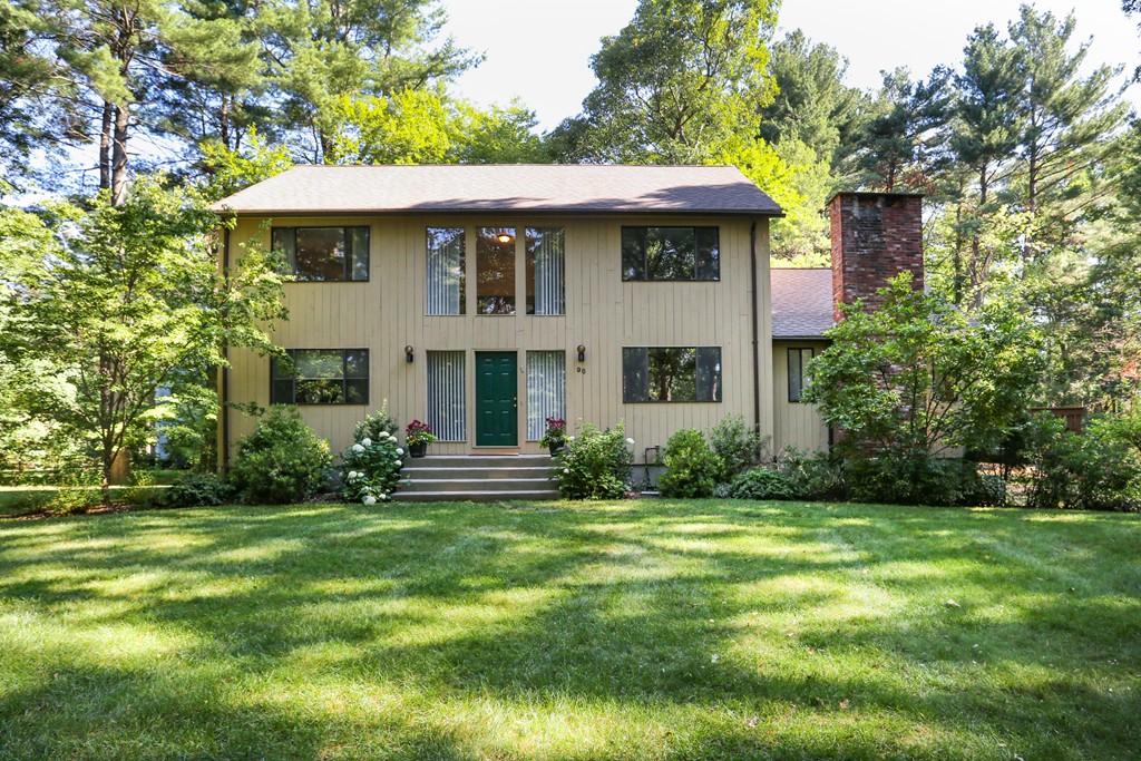 96 Stock Farm Road Sudbury, MA 01776 - Photo 1 of 30 a front view of a house with a yard