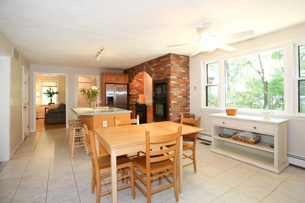 96 Stock Farm Road Sudbury, MA 01776 - Photo 11 of 30 a view of a dining room with furniture window and outside view