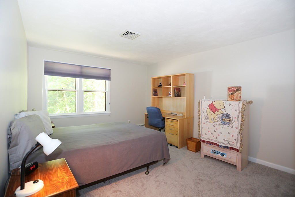 96 Stock Farm Road Sudbury, MA 01776 - Photo 21 of 30 a bedroom with a bed and window