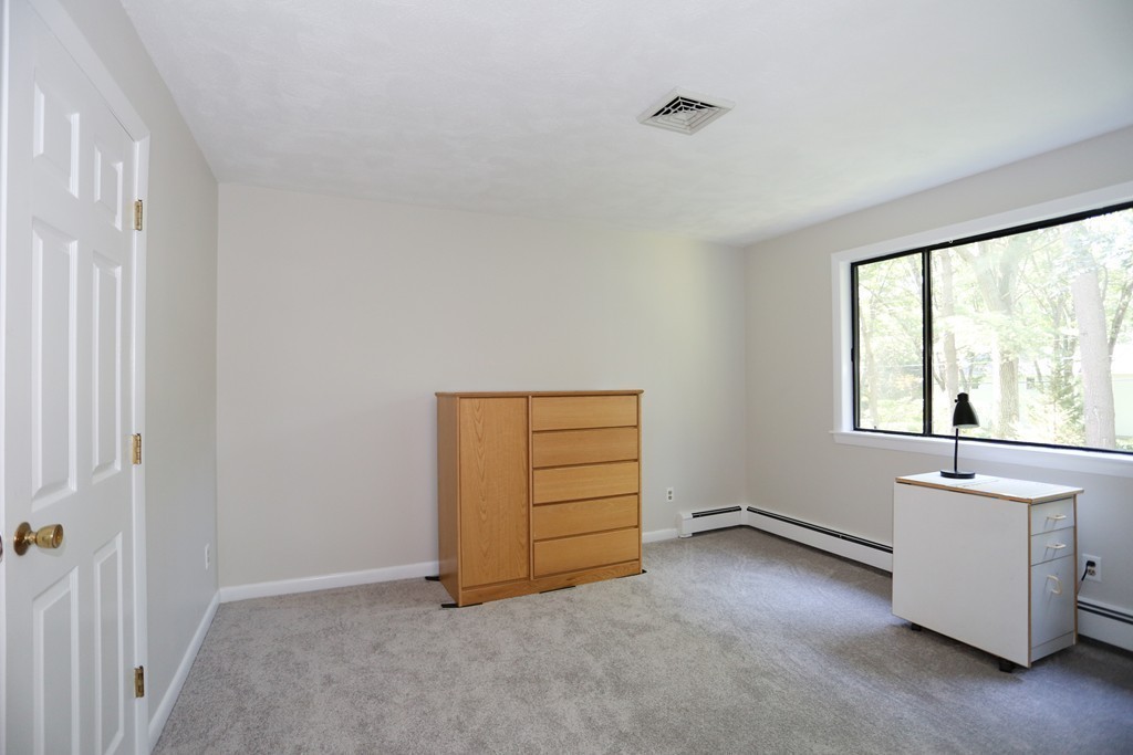 96 Stock Farm Road Sudbury, MA 01776 - Photo 22 of 30 an empty room with a window and a dresser