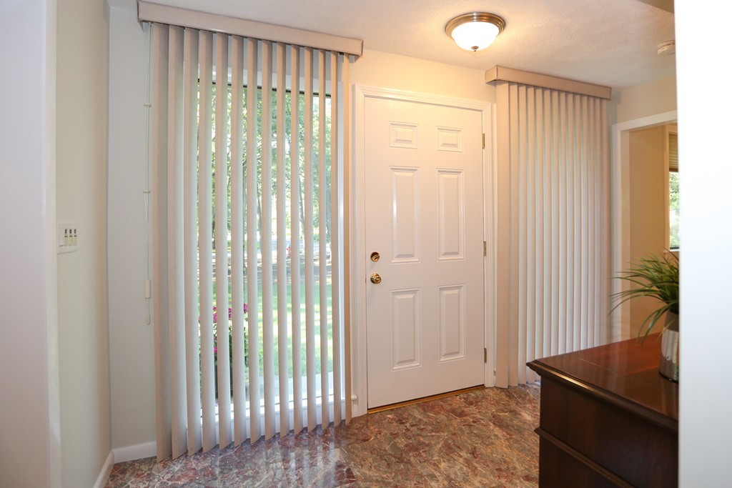 96 Stock Farm Road Sudbury, MA 01776 - Photo 4 of 30 a view of a room that has a bed in it