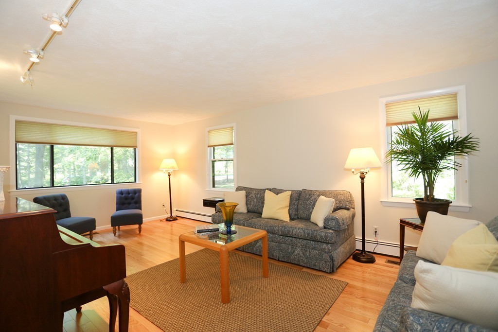 96 Stock Farm Road Sudbury, MA 01776 - Photo 6 of 30 a living room with furniture and a large window