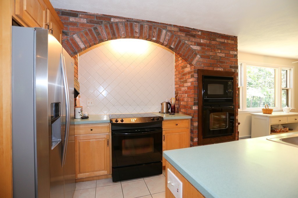 96 Stock Farm Road Sudbury, MA 01776 - Photo 9 of 30 a kitchen with a sink and a refrigerator