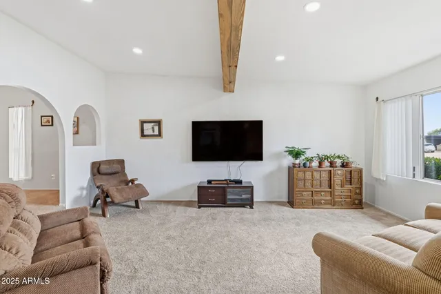 a view of a kitchen with a sink dishwasher refrigerator and cabinets