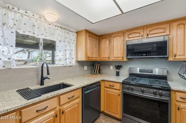 a bathroom with a sink and vanity