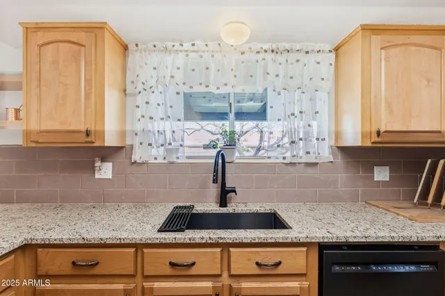 a view of a backyard of the house