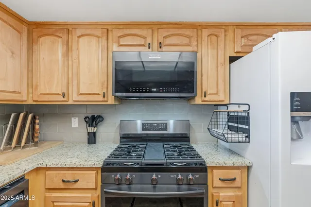 a view of a backyard of the house