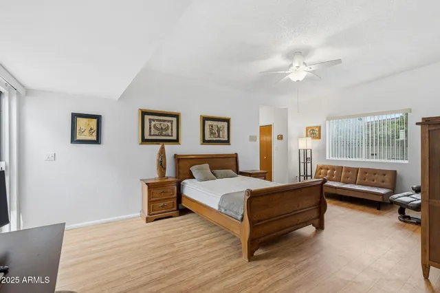 a view of a livingroom with furniture and a potted plant