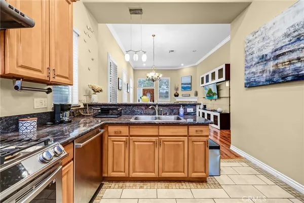 a kitchen with stainless steel appliances granite countertop a sink and cabinets