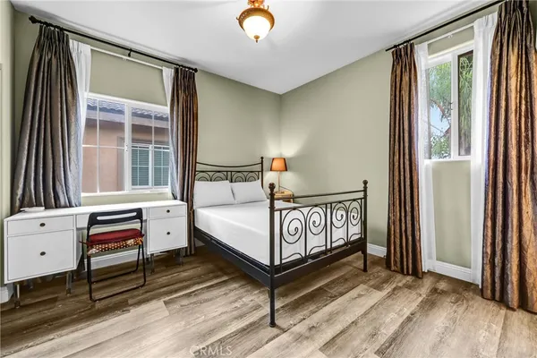 a bedroom with furniture and a window