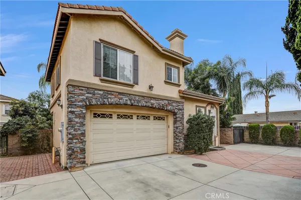 a front view of a house with a garage