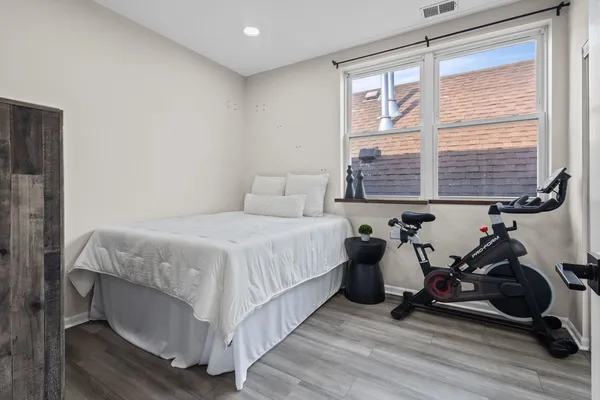 a bed room with a bed and a window
