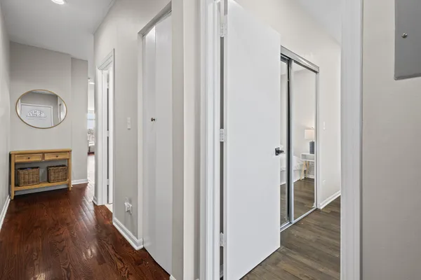 a view of an entryway with wooden floor